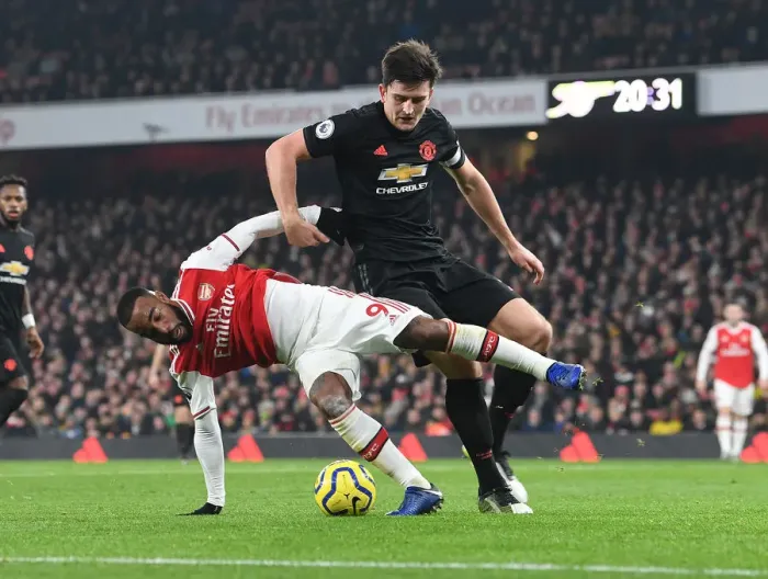 Framed Print : Arsenal vs Manchester United: Lacazette vs Maguire Clash in Premier League Showdown