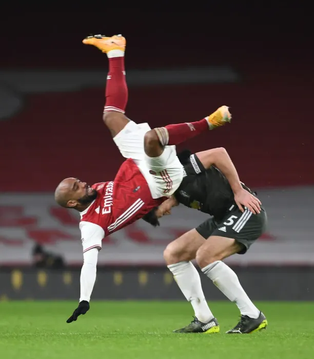 Framed Print : Arsenal vs Manchester United: Lacazette vs Maguire in Empty Emirates Stadium, Premier League 2020-21
