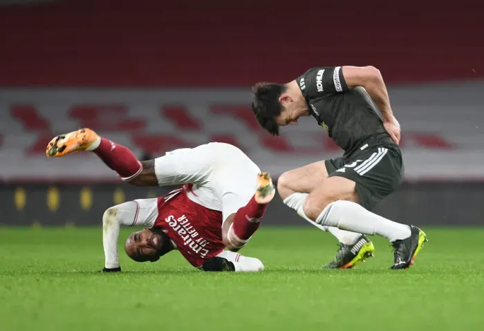Framed Print : Arsenal vs Manchester United: Lacazette vs Maguire - Empty Seat Showdown (Premier League 2021)