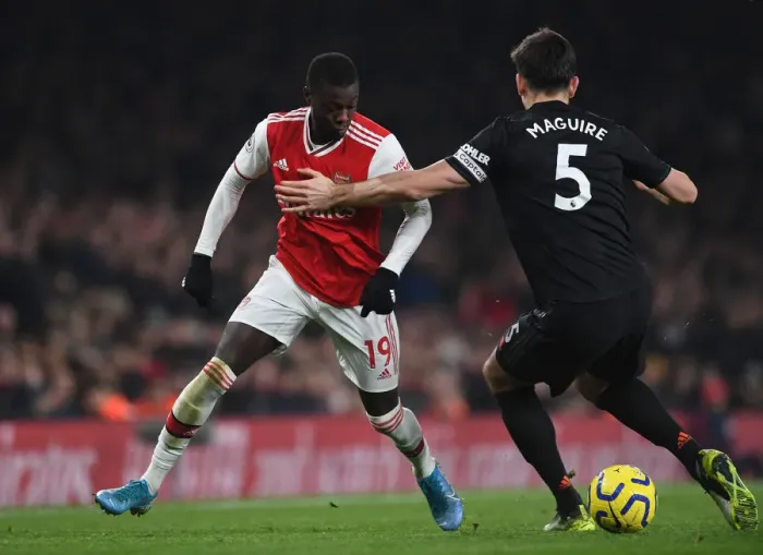 Framed Print : Arsenal vs Manchester United: Pepe Fouls by Maguire - Premier League Clash (2019-20)