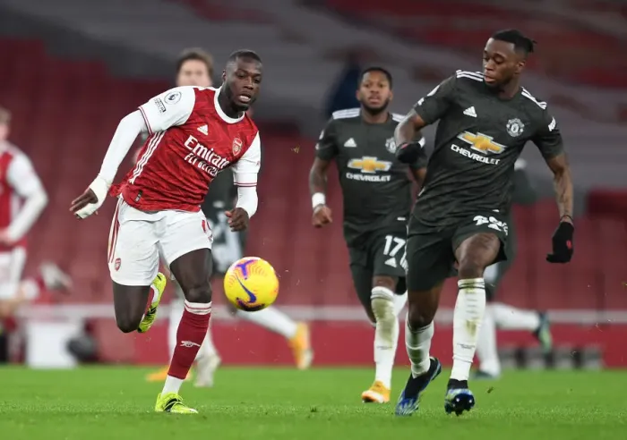 Framed Print : Arsenal vs Manchester United: Pepe vs Wan-Bissaka Clash in Empty Emirates Stadium (Premier League 2020-21)