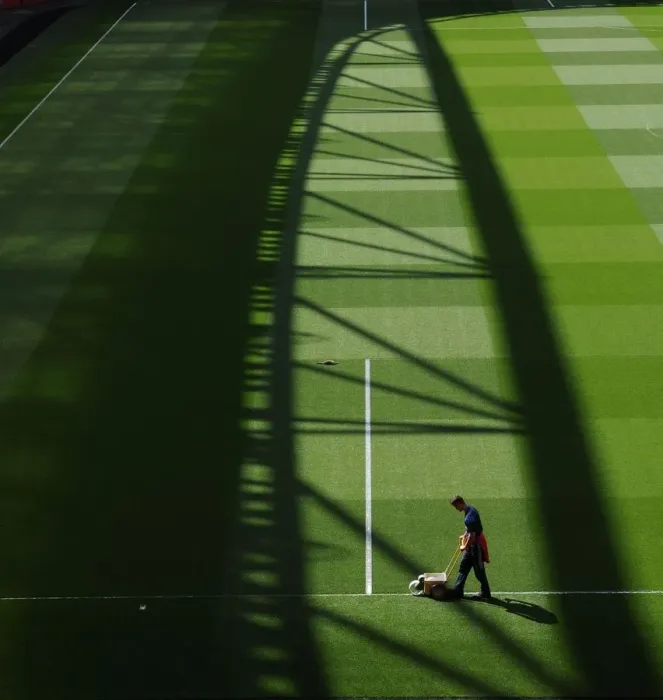 Framed Print : Arsenal vs Manchester United: Pre-Match Groundsmen Preparation at Emirates Stadium