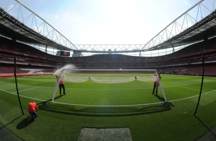 Framed Print : Arsenal vs Manchester United: Preparing the Turf for Premier League Battle