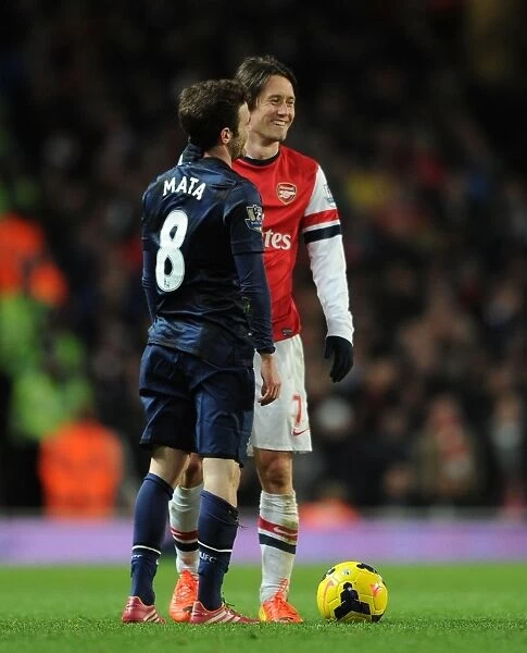 Arsenal vs Manchester United: Rosicky and Mata Share a Moment during the 2013-14 Premier League Clash