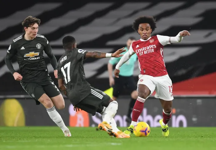 Framed Print : Arsenal vs Manchester United: Tension on the Pitch Amidst Empty Stands (2020-21)