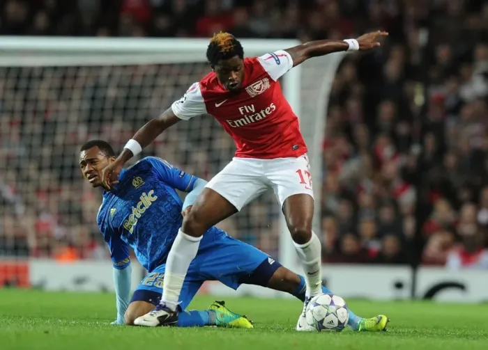 Framed Print : Arsenal vs. Marseille: Clash between Alex Song and Jordan Ayew in the 2011-12 UEFA Champions League Framed Print : Arsenal vs. Marseille: Clash between Alex Song and Jordan Ayew in the 2011-12 UEFA Champions League