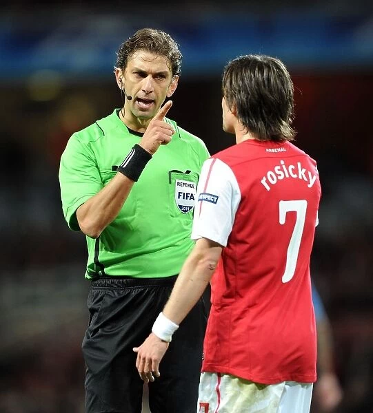 Arsenal vs Marseille: Referee Intervenes Between Paolo Tagliavento and Tomas Rosicky during UEFA Champions League Match at Emirates Stadium