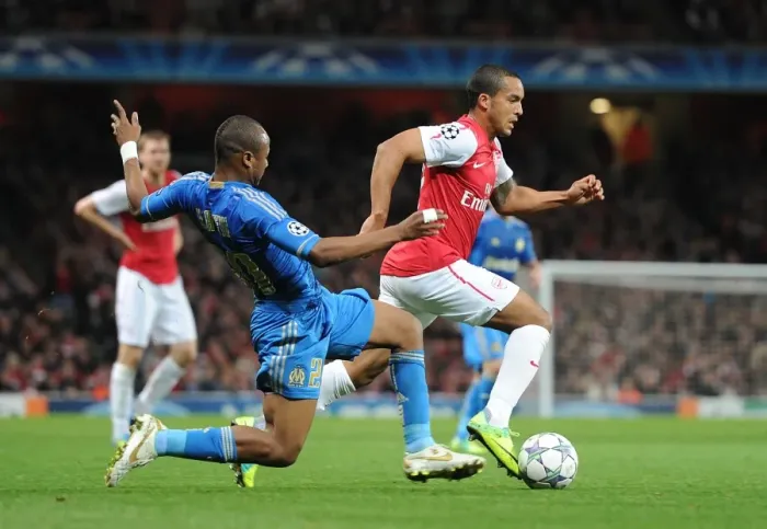 Framed Print : Arsenal vs. Marseille: Theo Walcott Clashes with Souleymane Diawara in the 2011-12 UEFA Champions League Framed Print : Arsenal vs. Marseille: Theo Walcott Clashes with Souleymane Diawara in the 2011-12 UEFA Champions League