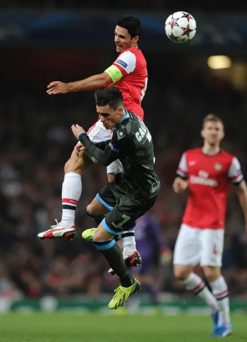 Framed Print : Arsenal vs. Napoli: Mikel Arteta vs. Jose Callejon Clash in 2013-14 Champions League
