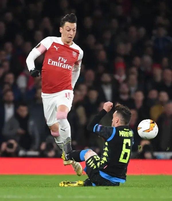 Framed Print : Arsenal vs. Napoli: Ozil Clashes with Rui in Europa League Quarterfinal Framed Print : Arsenal vs. Napoli: Ozil Clashes with Rui in Europa League Quarterfinal