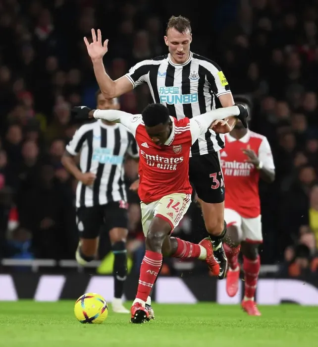 Framed Print : Arsenal vs Newcastle: Nketiah Fouls by Burn in Intense Premier League Clash (2022-23) Framed Print : Arsenal vs Newcastle: Nketiah Fouls by Burn in Intense Premier League Clash (2022-23)