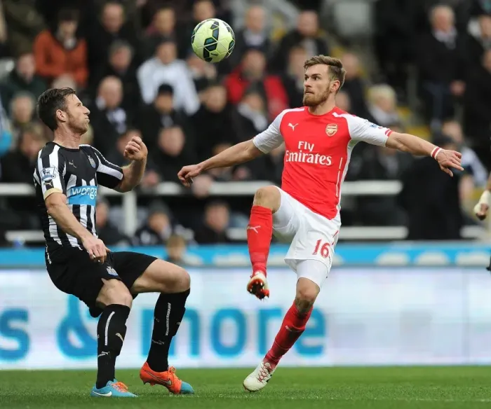 Framed Print : Arsenal vs. Newcastle United: Aaron Ramsey Faces Off Against Mike Williamson in Premier League Clash Framed Print : Arsenal vs. Newcastle United: Aaron Ramsey Faces Off Against Mike Williamson in Premier League Clash