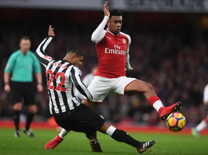 Framed Print : Arsenal vs Newcastle United: Iwobi Faces Off Against Yedlin in Premier League Clash