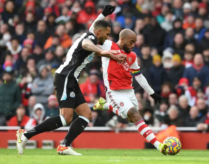 Framed Print : Arsenal vs Newcastle United: Lacazette vs Lascelles Clash in Premier League Showdown