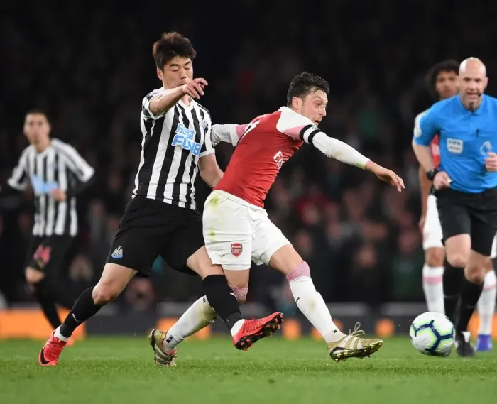 Framed Print : Arsenal vs Newcastle United: Mesut Ozil Faces Off Against Ki Sung-Yueng in Premier League Clash Framed Print : Arsenal vs Newcastle United: Mesut Ozil Faces Off Against Ki Sung-Yueng in Premier League Clash
