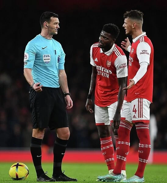Arsenal vs Newcastle United: Partey and White in Deep Conversation with Referee during Premier League Clash at Emirates Stadium