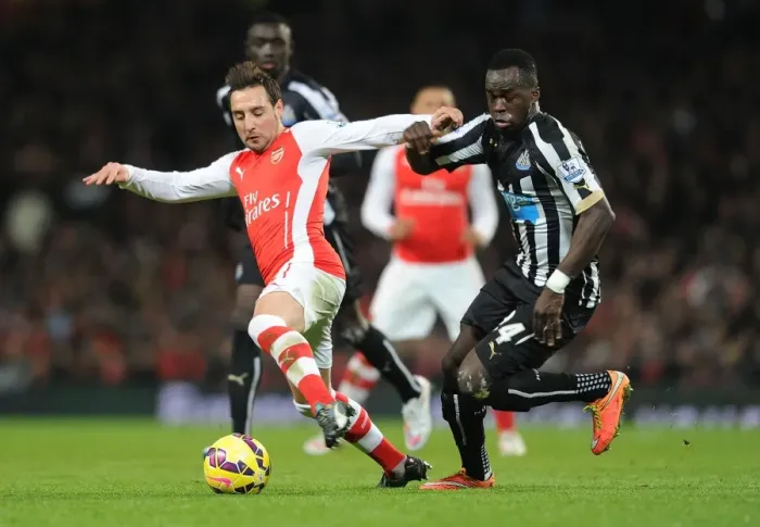 Framed Print : Arsenal vs Newcastle United: Santi Cazorla vs Cheick Tiote - Premier League Showdown, Emirates Stadium, London, 2014 Framed Print : Arsenal vs Newcastle United: Santi Cazorla vs Cheick Tiote - Premier League Showdown, Emirates Stadium, London, 2014