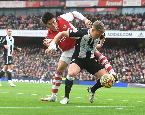 Arsenal vs Newcastle United: Tomiyasu Tackles Ritchie in Premier League Clash