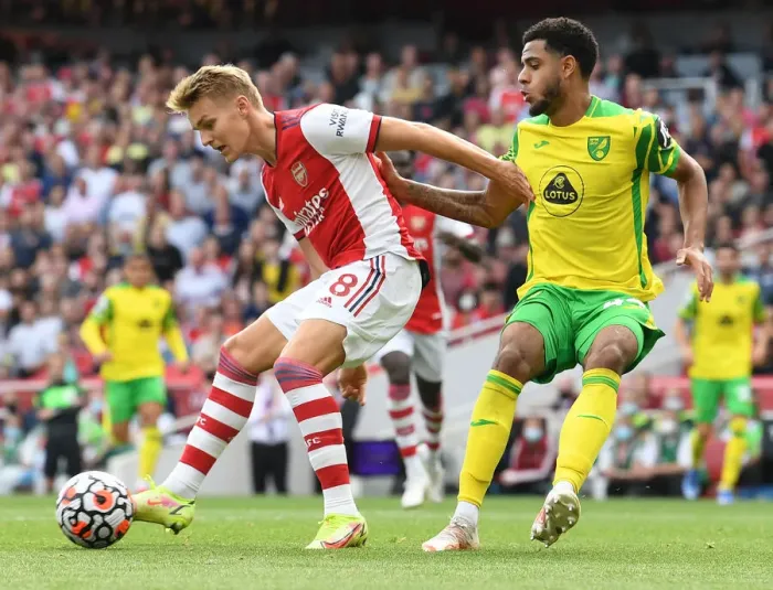 Framed Print : Arsenal vs Norwich City: Martin Odegaard Faces Off Against Omobamidele in Premier League Clash