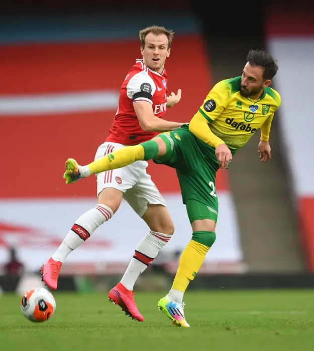 Framed Print : Arsenal vs Norwich: Holding vs Drmic - Premier League Clash at Emirates Stadium