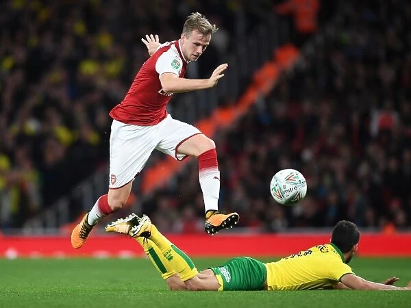 Arsenal vs. Norwich: Intense Battle Between Rob Holding and Mario Vrancic in Carabao Cup