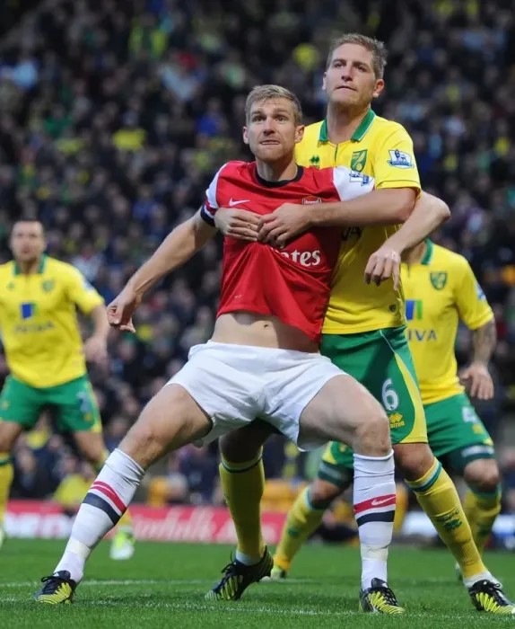 Framed Print : Arsenal vs Norwich: Mertesacker and Turner Clash in Intense Premier League Encounter (2012-13)