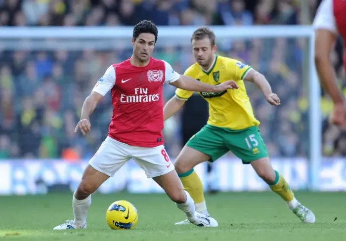 Framed Print : Arsenal vs. Norwich: Mikel Arteta vs. David Fox - Premier League Clash at Carrow Road (November 19, 2011)