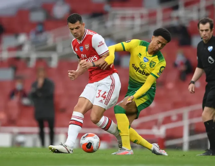 Framed Print : Arsenal vs Norwich: Xhaka Tackles Lewis in Intense Premier League Clash Framed Print : Arsenal vs Norwich: Xhaka Tackles Lewis in Intense Premier League Clash
