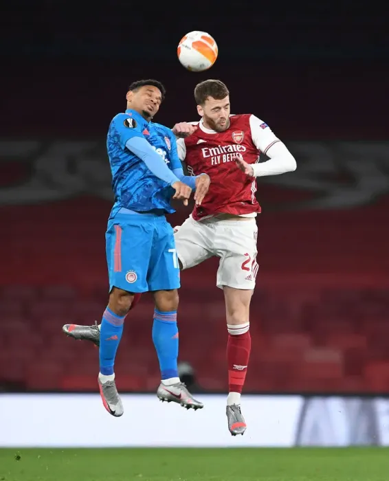 Framed Print : Arsenal vs. Olympiacos: Calum Chambers Heads the Ball in Empty Emirates Stadium - UEFA Europa League Round of 16 Framed Print : Arsenal vs. Olympiacos: Calum Chambers Heads the Ball in Empty Emirates Stadium - UEFA Europa League Round of 16