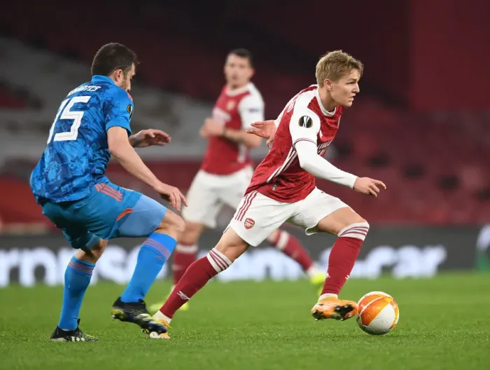 Framed Print : Arsenal vs Olympiacos: Clash of Martin Odegaard and Sokratis in Empty Europa League Match, London, 2021 Framed Print : Arsenal vs Olympiacos: Clash of Martin Odegaard and Sokratis in Empty Europa League Match, London, 2021