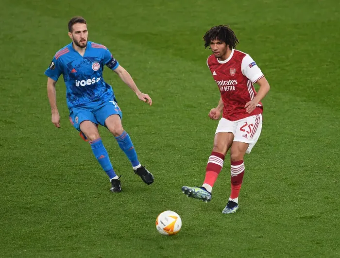 Framed Print : Arsenal vs Olympiacos: Elneny Fends Off Fortounis in Empty Europa League Clash