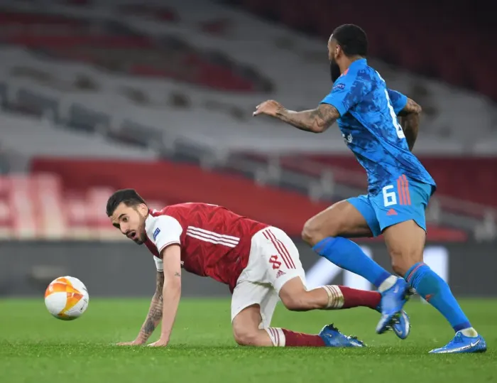 Framed Print : Arsenal vs Olympiacos: Empty Emirates Stadium Clash in Europa League Round of 16