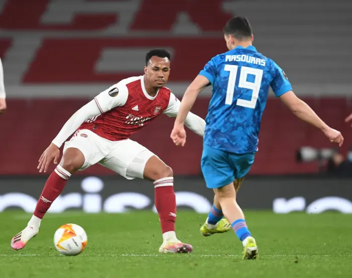 Framed Print : Arsenal vs Olympiacos: Gabriel Clashes in Empty Emirates Stadium - UEFA Europa League Round of 16, 2021
