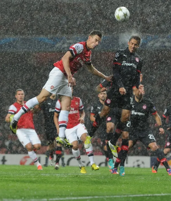 Framed Print : Arsenal vs. Olympiacos: Koscielny vs. Fuster in Champions League Clash Framed Print : Arsenal vs. Olympiacos: Koscielny vs. Fuster in Champions League Clash