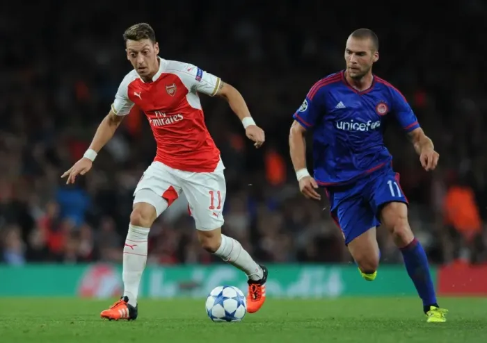 Framed Print : Arsenal vs. Olympiacos: Ozil vs. Kasami Clash in the 2015 / 16 UEFA Champions League