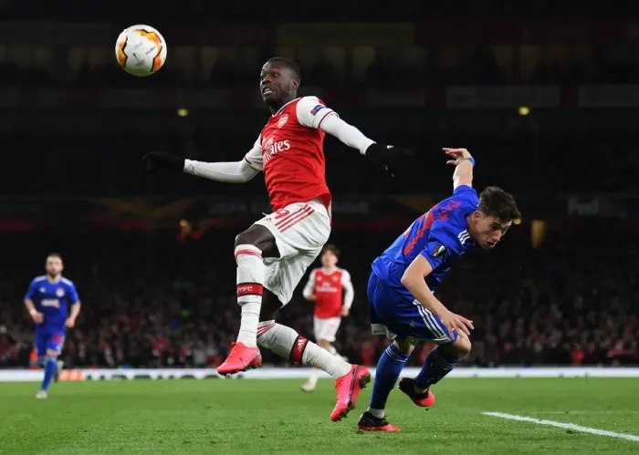 Framed Print : Arsenal vs Olympiacos: Pepe Under Pressure in Europa League Clash Framed Print : Arsenal vs Olympiacos: Pepe Under Pressure in Europa League Clash