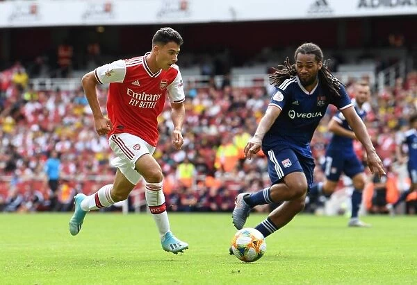 Arsenal vs. Olympique Lyonnais: Gabriel Martinelli Clashes with Jason Denayer at the Emirates Cup