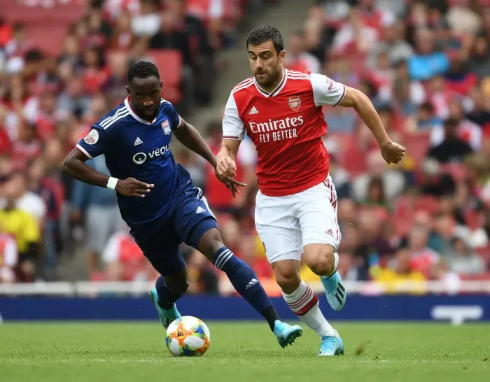 Framed Print : Arsenal vs. Olympique Lyonnais: Sokratis Breaks Past Moussa Dembele at the Emirates Cup