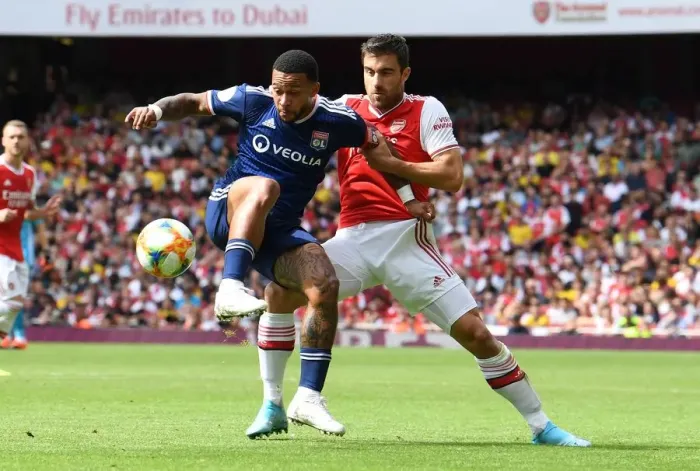 Framed Print : Arsenal vs. Olympique Lyonnais: Sokratis vs. Mephis Depay Clash at the Emirates Cup Framed Print : Arsenal vs. Olympique Lyonnais: Sokratis vs. Mephis Depay Clash at the Emirates Cup