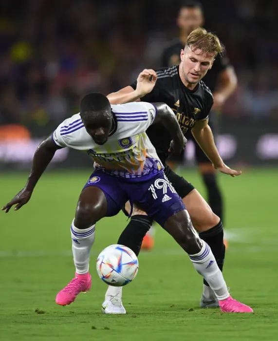 Framed Print : Arsenal vs Orlando City SC: Rob Holding Clashes with Benji Michel in Pre-Season Friendly