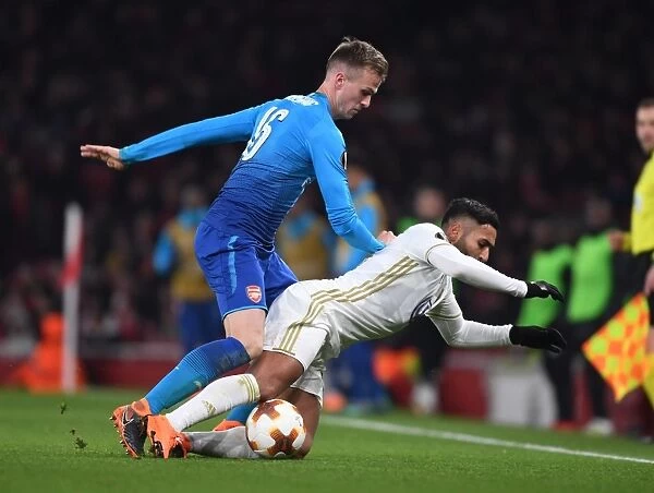 Arsenal vs Östersunds FK: Rob Holding Tackles Saman Ghoddos in Europa League Clash