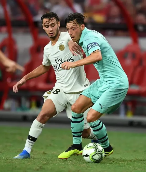 Framed Print : Arsenal vs. Paris Saint-Germain: Mesut Ozil Clashes with Azzedine Toufiqui in International Champions Cup 2018