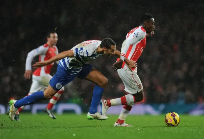Framed Print : Arsenal vs. QPR: Tense Moment Between Danny Welbeck and Rio Ferdinand Framed Print : Arsenal vs. QPR: Tense Moment Between Danny Welbeck and Rio Ferdinand