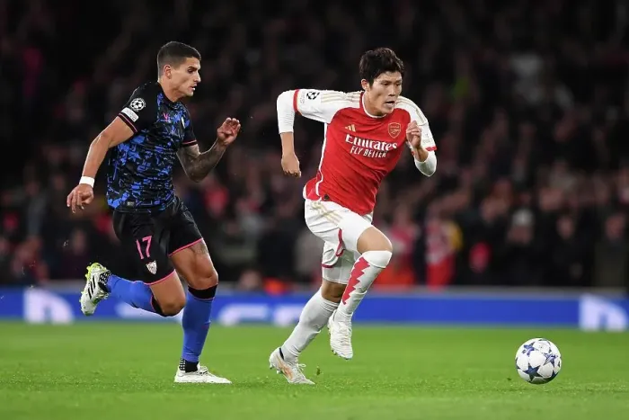 Framed Print : Arsenal vs Sevilla: Battle in Group B - Arsenal's Tomiyasu Outruns Lamela in the UEFA Champions League 2023 / 24 Framed Print : Arsenal vs Sevilla: Battle in Group B - Arsenal's Tomiyasu Outruns Lamela in the UEFA Champions League 2023 / 24