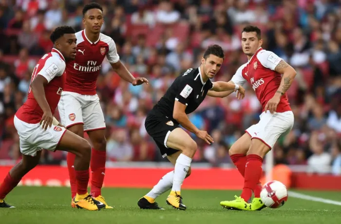 Framed Print : Arsenal vs Sevilla: Clash between Iwobi, Xhaka, Bramall, and Corchia at the Emirates Cup