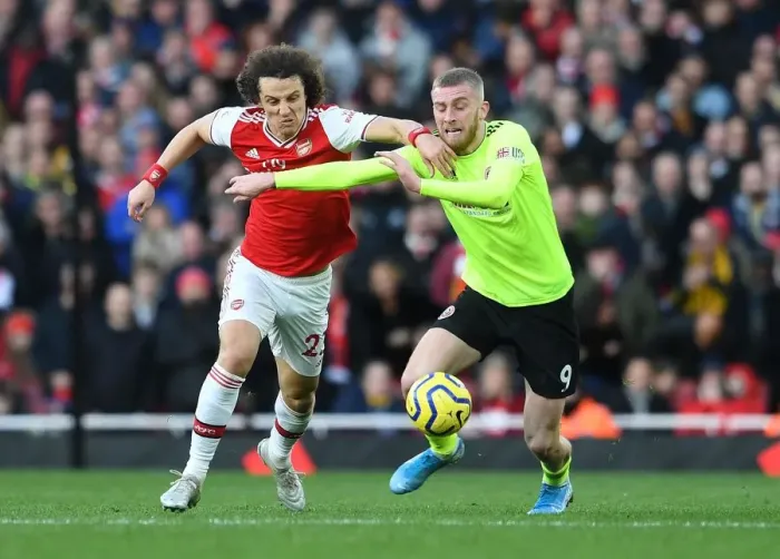 Framed Print : Arsenal vs Sheffield United: David Luiz Faces Off Against Oli McBurnie in Premier League Clash