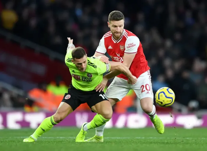 Framed Print : Arsenal vs Sheffield United: Mustafi Clashes with Sharp in Premier League Showdown Framed Print : Arsenal vs Sheffield United: Mustafi Clashes with Sharp in Premier League Showdown