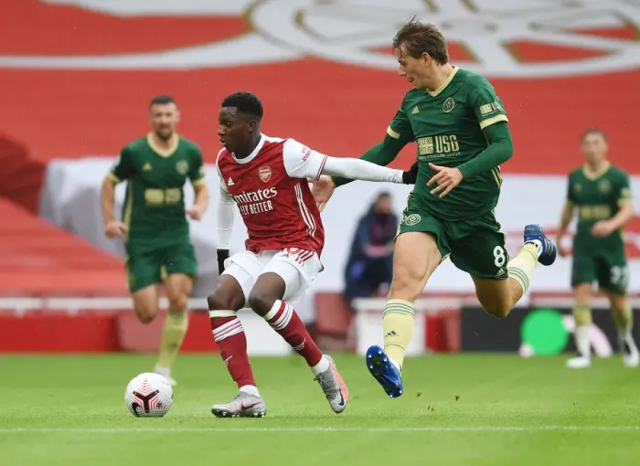 Framed Print : Arsenal vs Sheffield United: Nketiah Takes on Berge in Empty Emirates Stadium, Premier League 2020-21 Framed Print : Arsenal vs Sheffield United: Nketiah Takes on Berge in Empty Emirates Stadium, Premier League 2020-21
