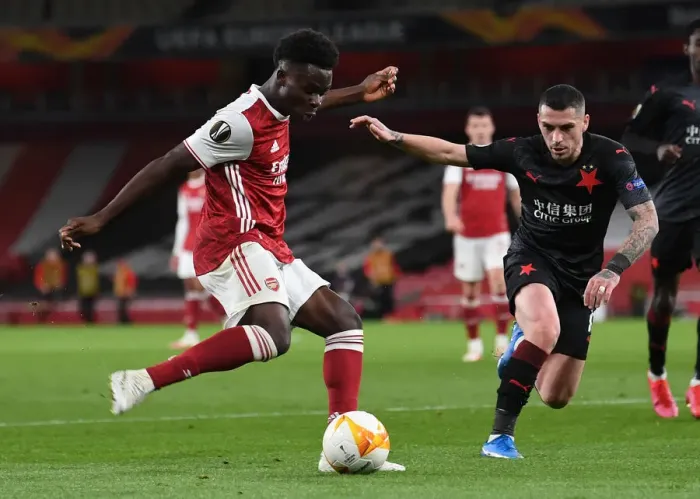 Framed Print : Arsenal vs Slavia Prague: Bukayo Saka Tackled in UEFA Europa League Quarterfinal at Empty Emirates Stadium Framed Print : Arsenal vs Slavia Prague: Bukayo Saka Tackled in UEFA Europa League Quarterfinal at Empty Emirates Stadium