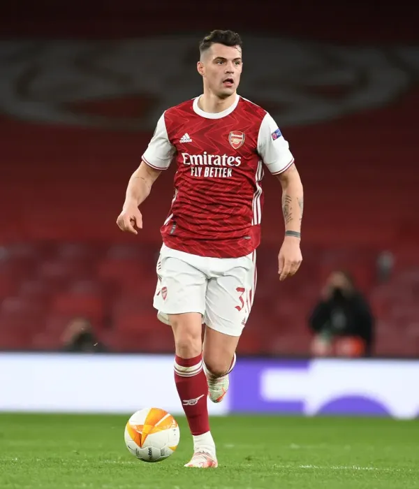 Framed Print : Arsenal vs Slavia Praha: Granit Xhaka in UEFA Europa League Quarterfinal at Empty Emirates Stadium